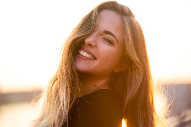 blonde woman smiling at the camera
