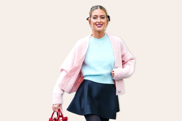 Emili Sindlev wears a necklace, a pass pink cardigan, a blue wool pullover, a mini skirt , a red bag, outside Prada