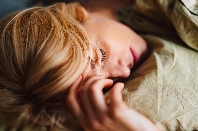 Cropped Photo of a Blonde Woman Sleeping in the Morning