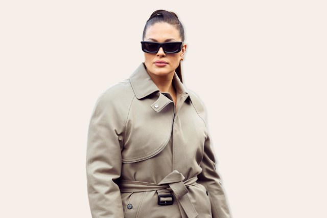 Ashley Graham seen wearing a beige brown long trench coat, beige wide pants and black sunglasses outside Off-White show during Paris Fashion Week - Womenswear Fall Winter 2023 2024, on March 02, 2023 in Paris, France. 