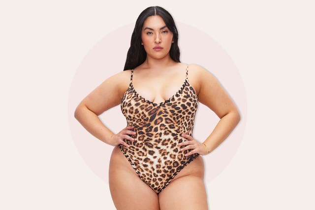 Image of brunette woman in leopard print one-piece bathing suit
