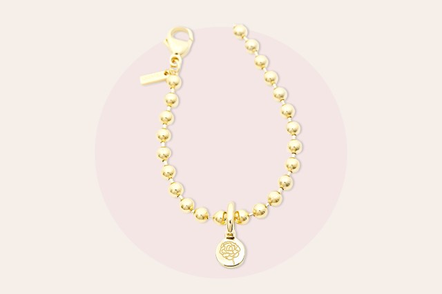 Gold, pearl charm necklace with flower charm
