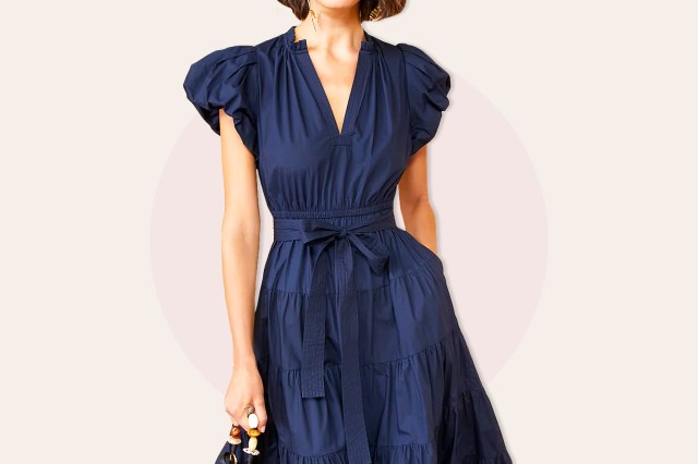 Woman in blue short sleeve dress