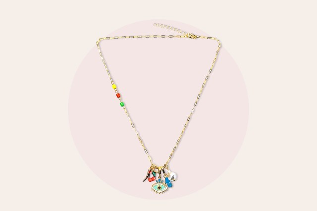 Gold, charm necklace with various charms on the end