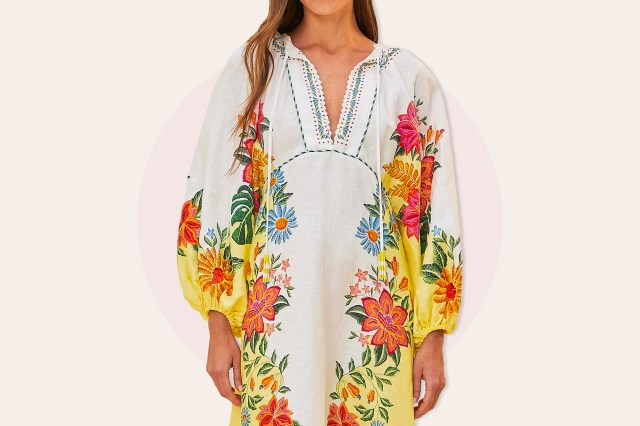 Woman in long sleeve white/colorful floral dress