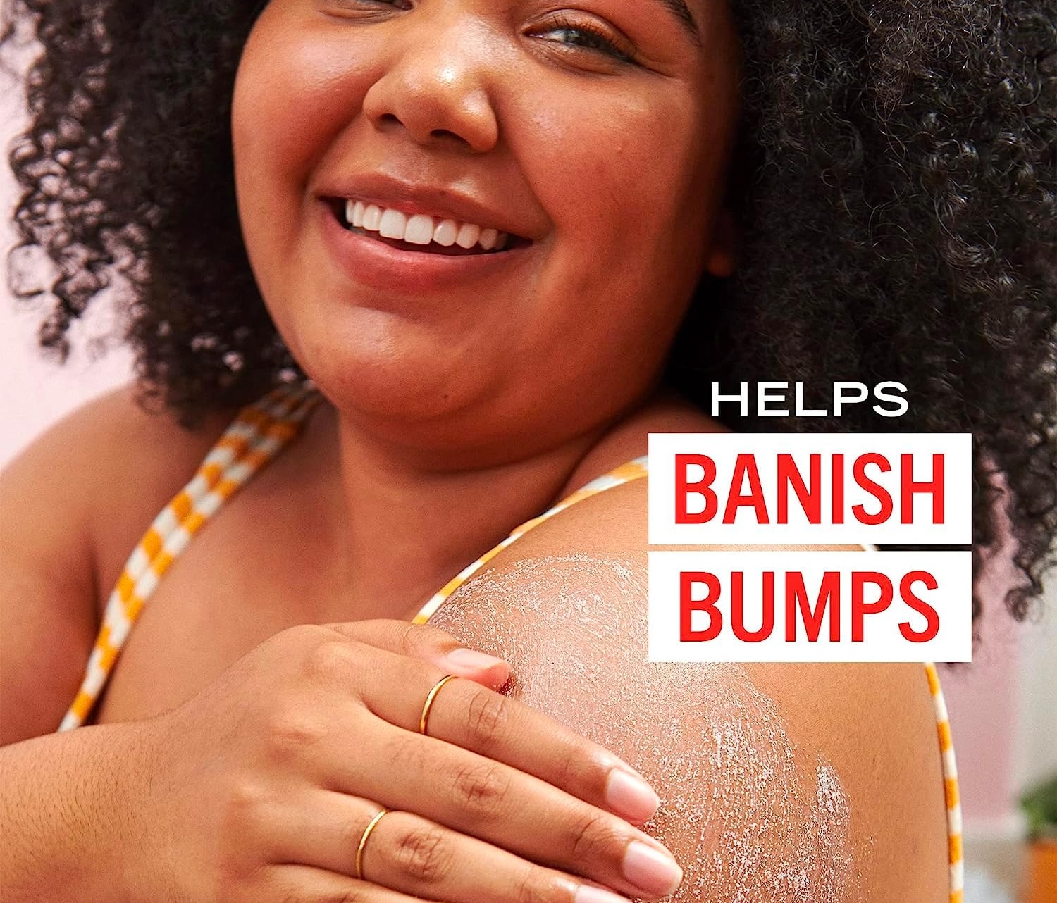 woman with scrub on her harm and writing saying helps banish bumps