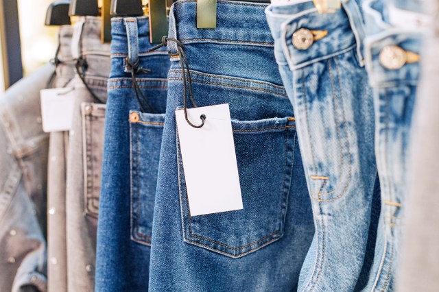 Close up of jeans on hangers in clothing store