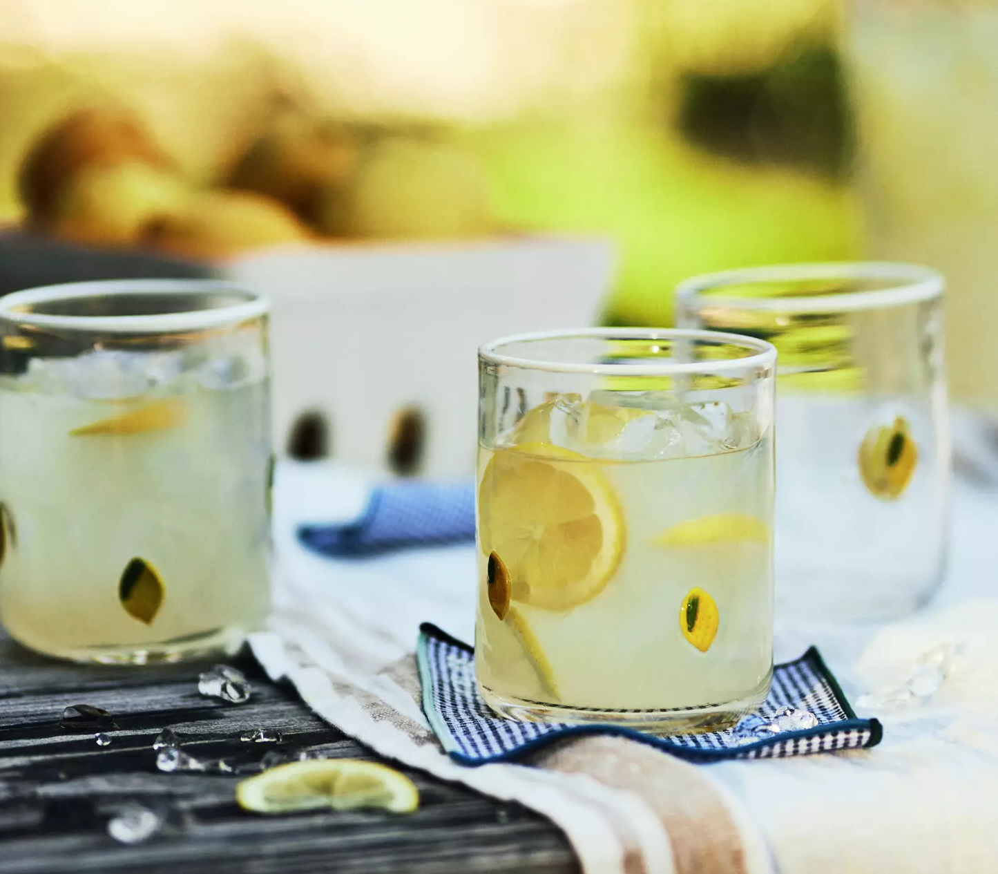 glasses with lemon designs on outdoor table 