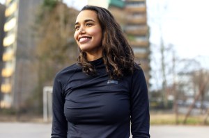 Athletic woman, smiling standing outside