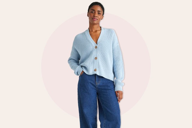 Woman wearing blue cardigan and jeans