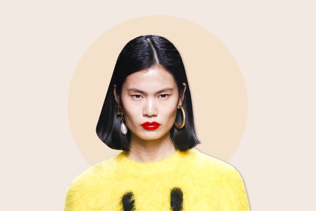 Model wearing yellow sweater and red lipstick