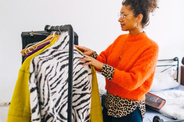 Woman looking at clothes on a clothing rack