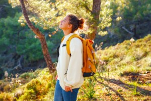 Woman with backpack in nature