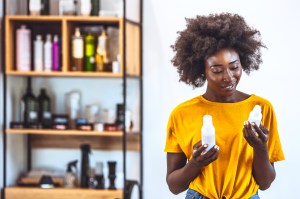 Woman looking at hair care products