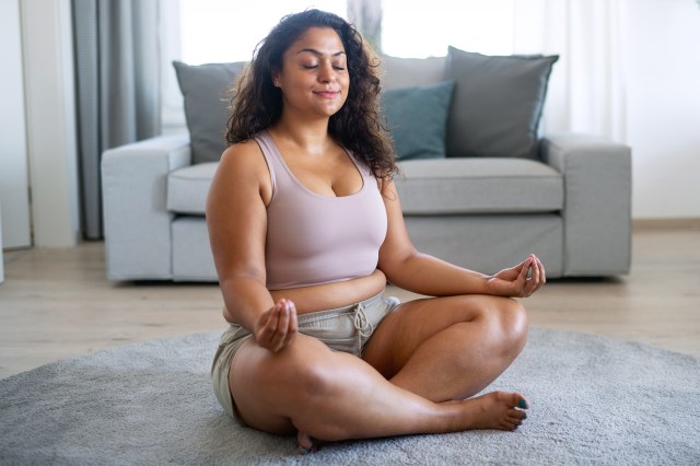 Woman meditating at home