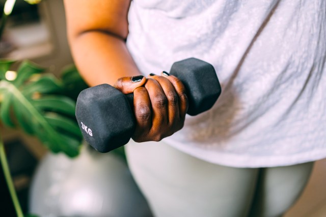 Close up of woman lifting weight