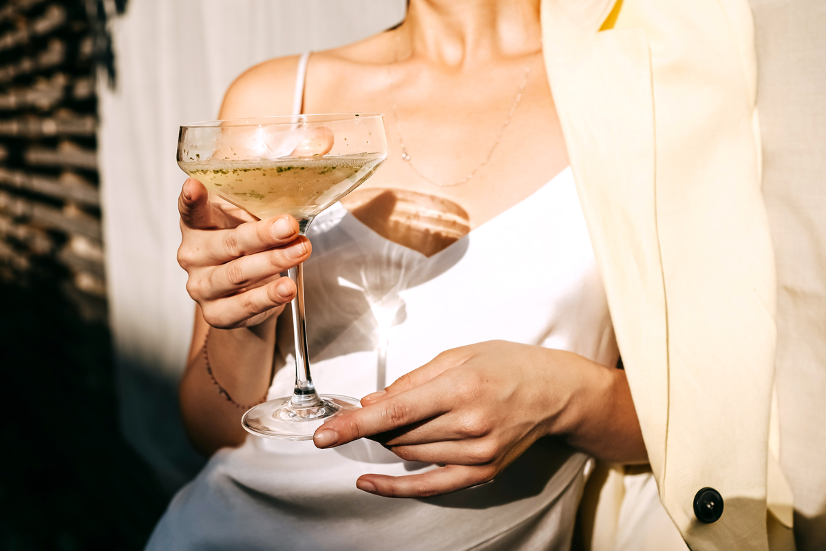 Woman holding wine glass at party