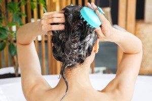 woman washing hair in the bath