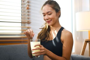 Woman drinking supplement drink