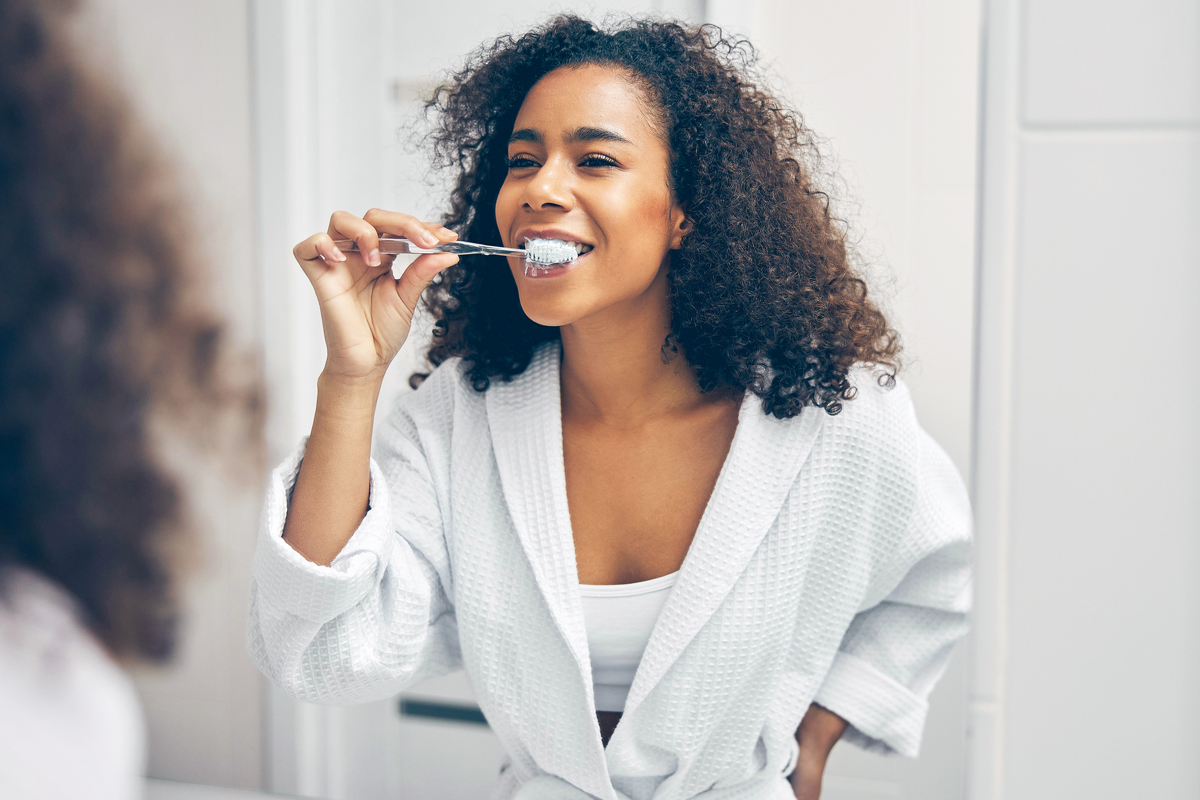 woman brushing her teeth